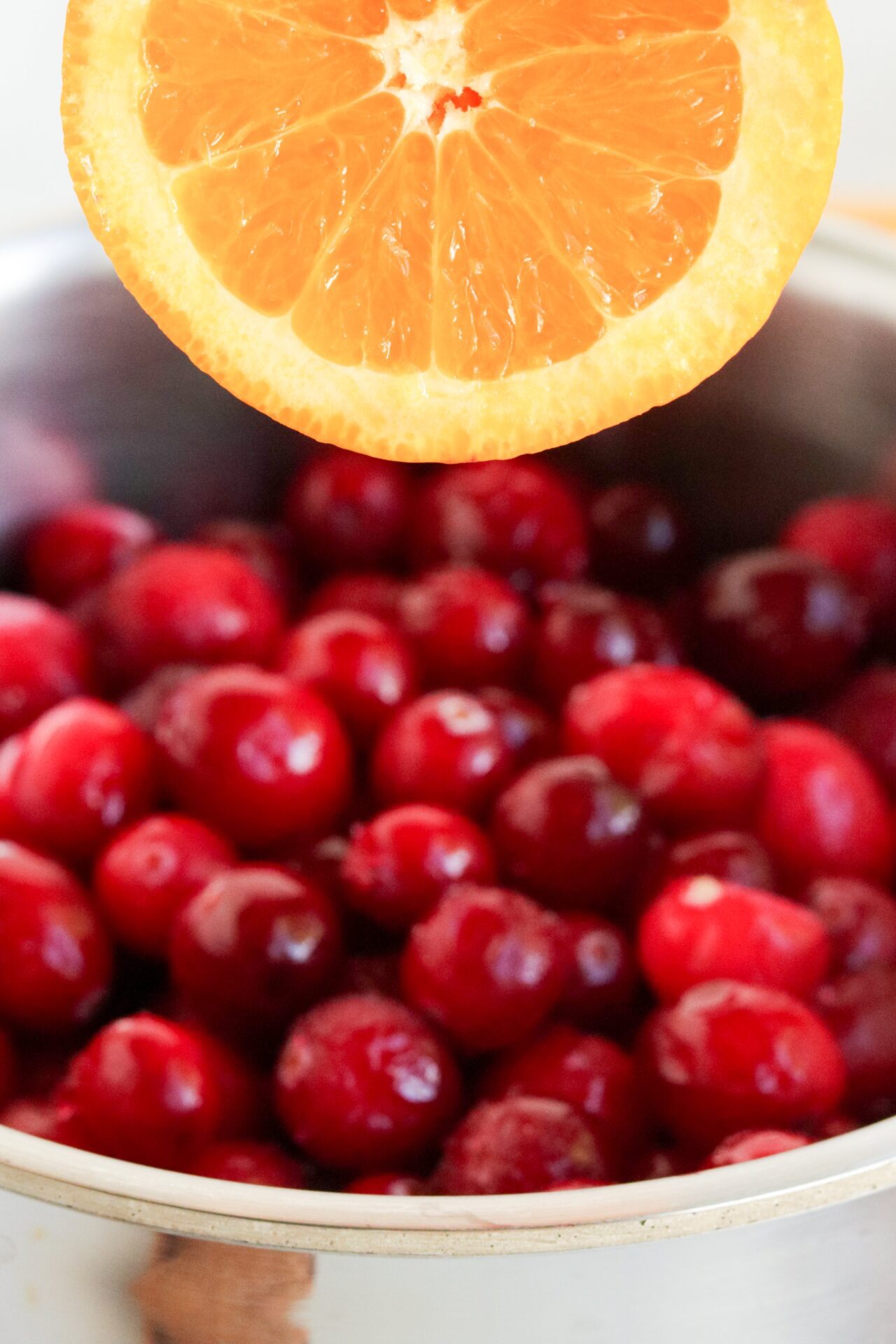 pot of cranberries with orange slice