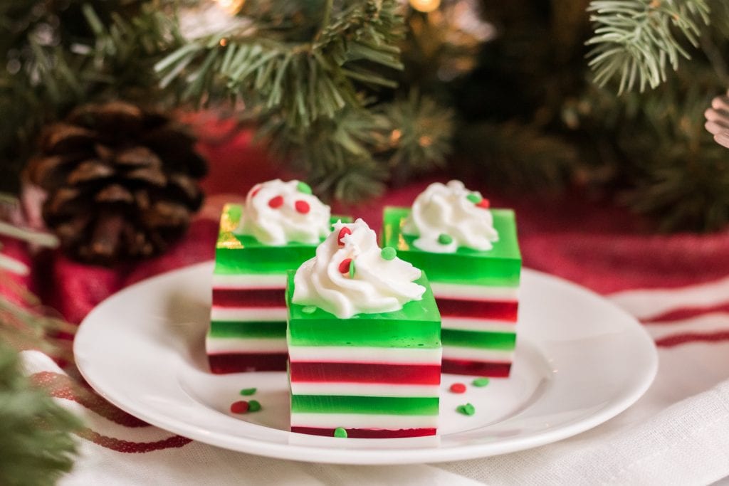 This festive red and green Christmas layered jello is the perfect Christmas finger jello for your next holiday gathering. Kids and adults love eating jello fingers!