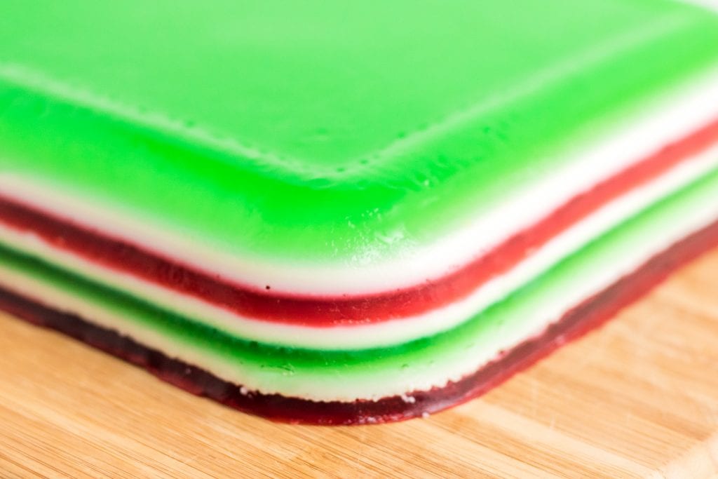Layered jello flipped out of the pan ready to cut