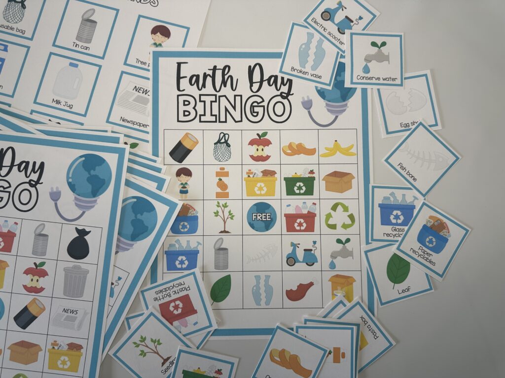 horizontal image of earth day bingo card with calling card pieces cut out on white background