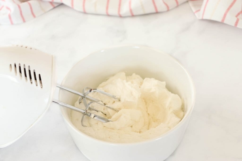 Have you been wanting to know how to make your own homemade whipped cream? This recipe is sweet and simple and tastes so much better than the store-bought alternatives!