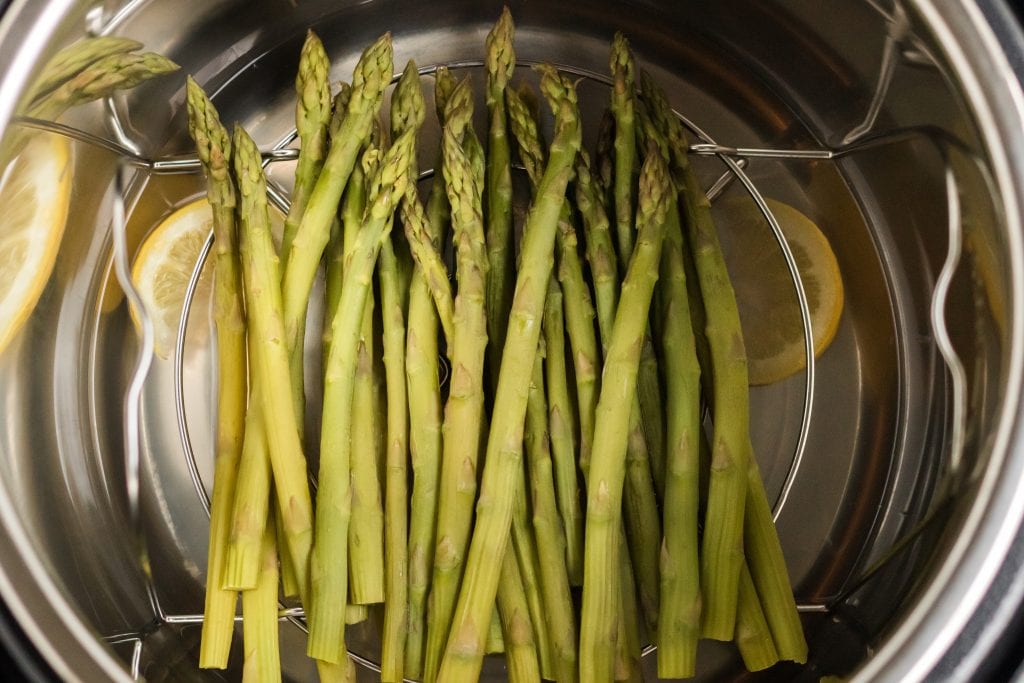asparagus inside of instant pot on cooking rack