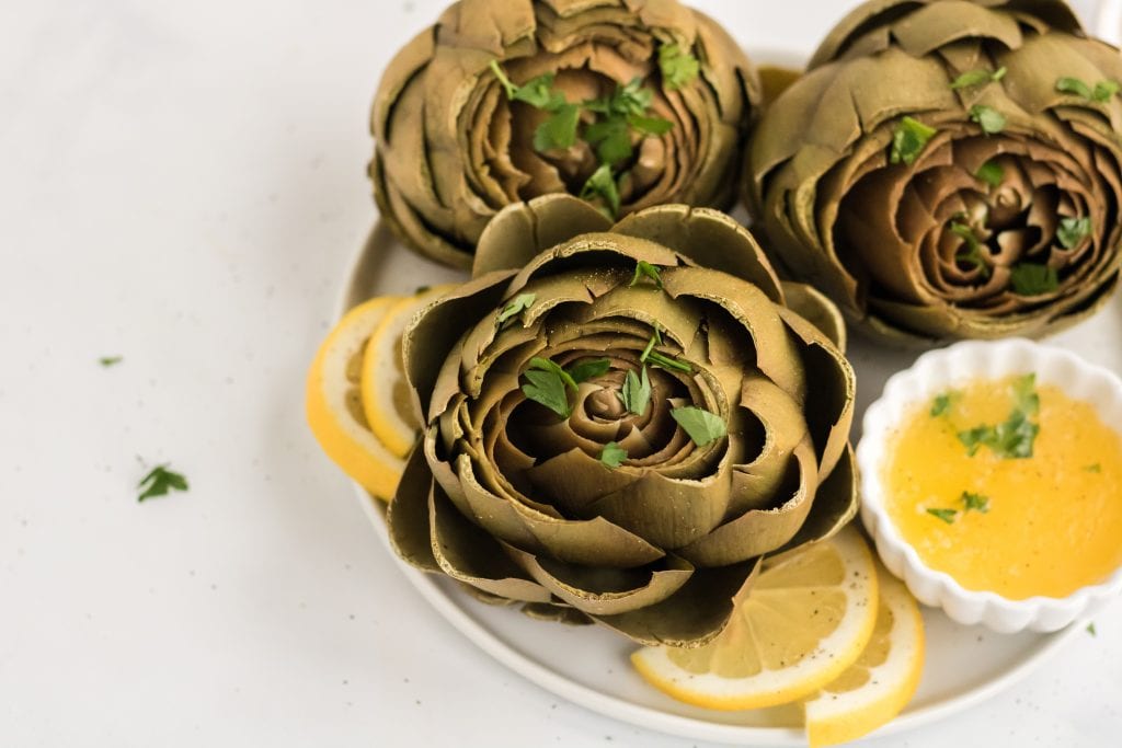 Cooking artichokes is made much easier with your instant pot! This recipe for Instant Pot Artichokes is going to be your new favorite method for delicious artichokes.