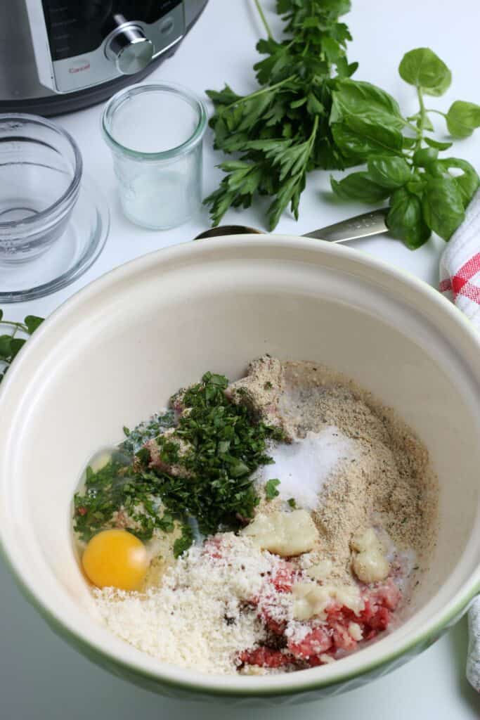 All the other ingredients are added to the bowl of the ground meat mixture.