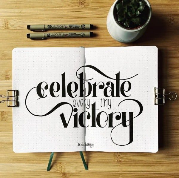 Celebrate every tiny victory quote with markers and a cup