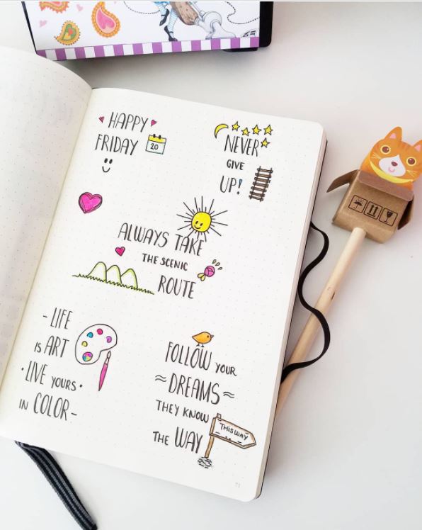 Multiple bullet journal quotes with a cat bookmark