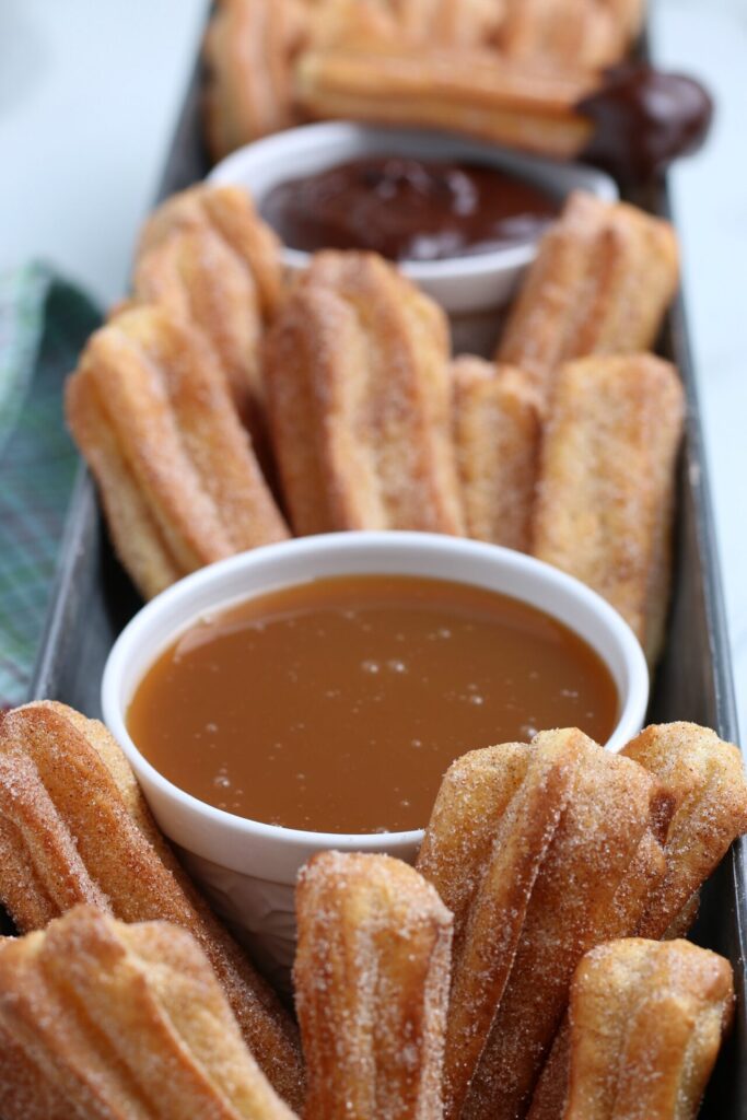 close up shot of air fryer churros and sauces