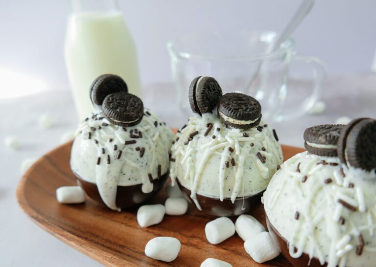 oreo hot chocolate bombs with milk and glass bowl