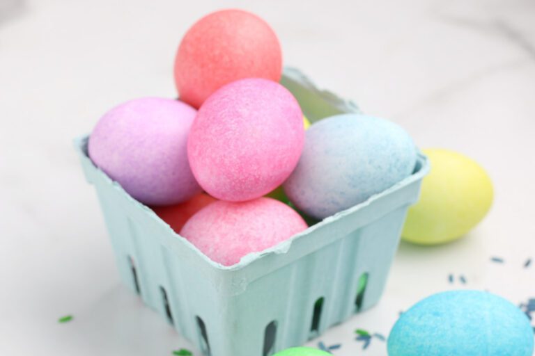 cardboard green box with speckled colored eggs