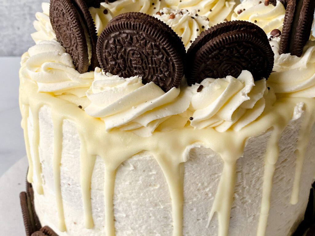 close up of buttercream swirls on oreo drip cake