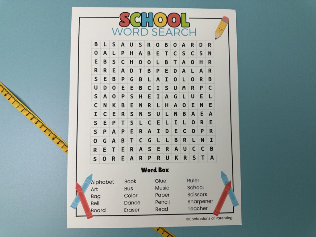 Printable school word search with colorful header and a list of school-related words like alphabet, pencil, and teacher.