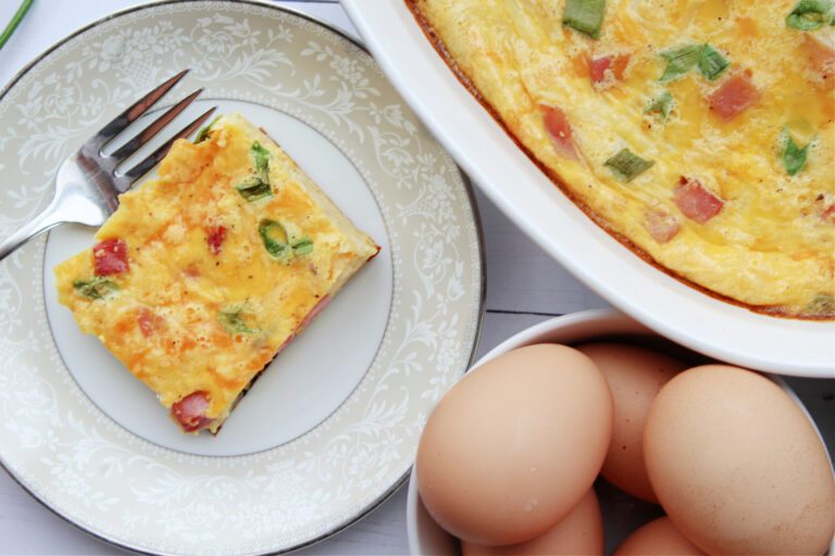 overhead shot of slice of ham and cheese breakfast casserole