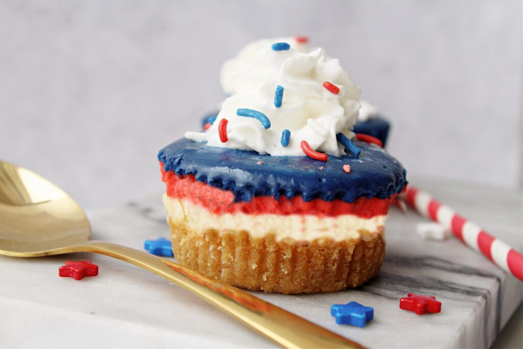 Patriotic Mini Cheesecakes with gold spoon and red and white straw