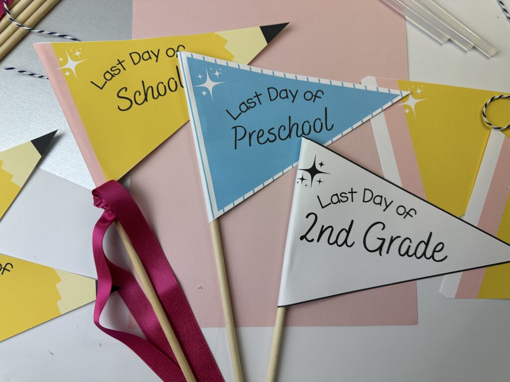3 last day of school flags on pink and silver backgroun