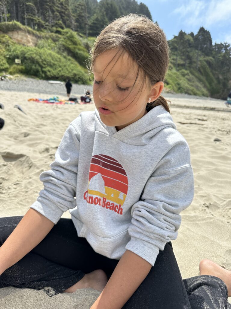 little girl playing on the beach