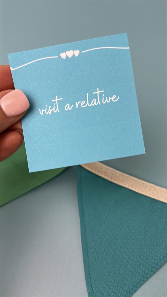 visit a relative summer bucket list card held up.