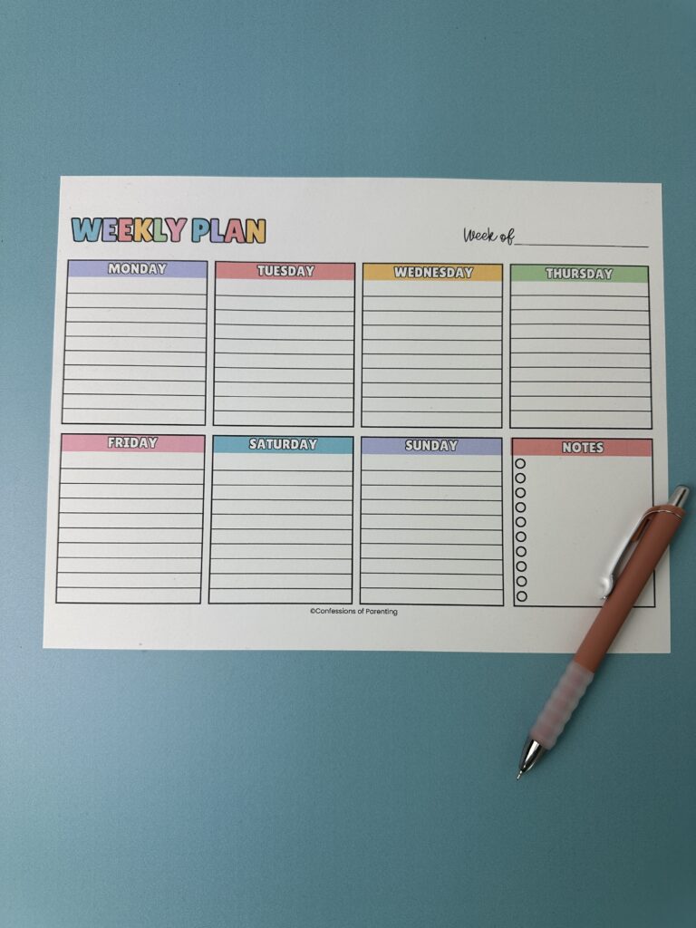 Close-up of a weekly planner page with blocks for each day of the week, plus sections for goals, notes, and a notes checklist.