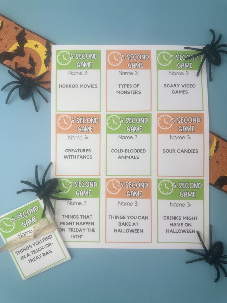 Printable Halloween 5 Second Game sheet showing multiple cards with prompts like “Horror movies,” “Types of monsters,” and “Scary video games,” decorated with spiders and ribbon.