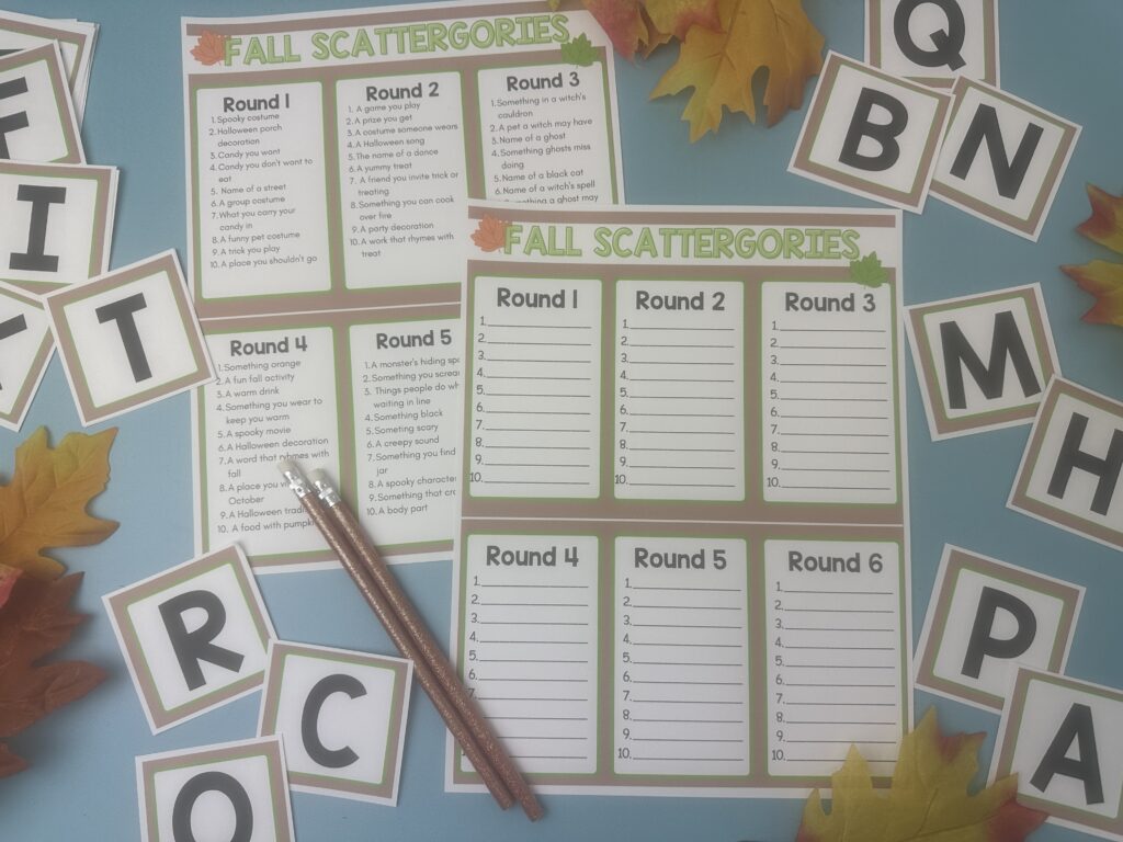 Printable Fall Scattergories game sheets with themed prompts for multiple rounds, surrounded by alphabet letter cards, fall leaves, and two pencils on a blue background.