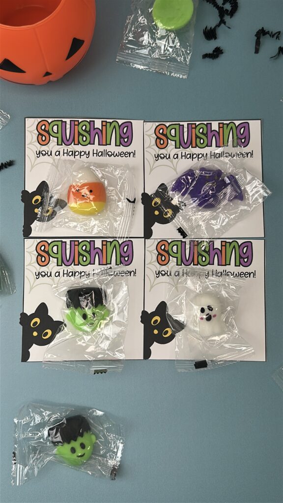 Set of Halloween squishy toy tags each holding a toy—candy corn, bat, Frankenstein, and ghost.