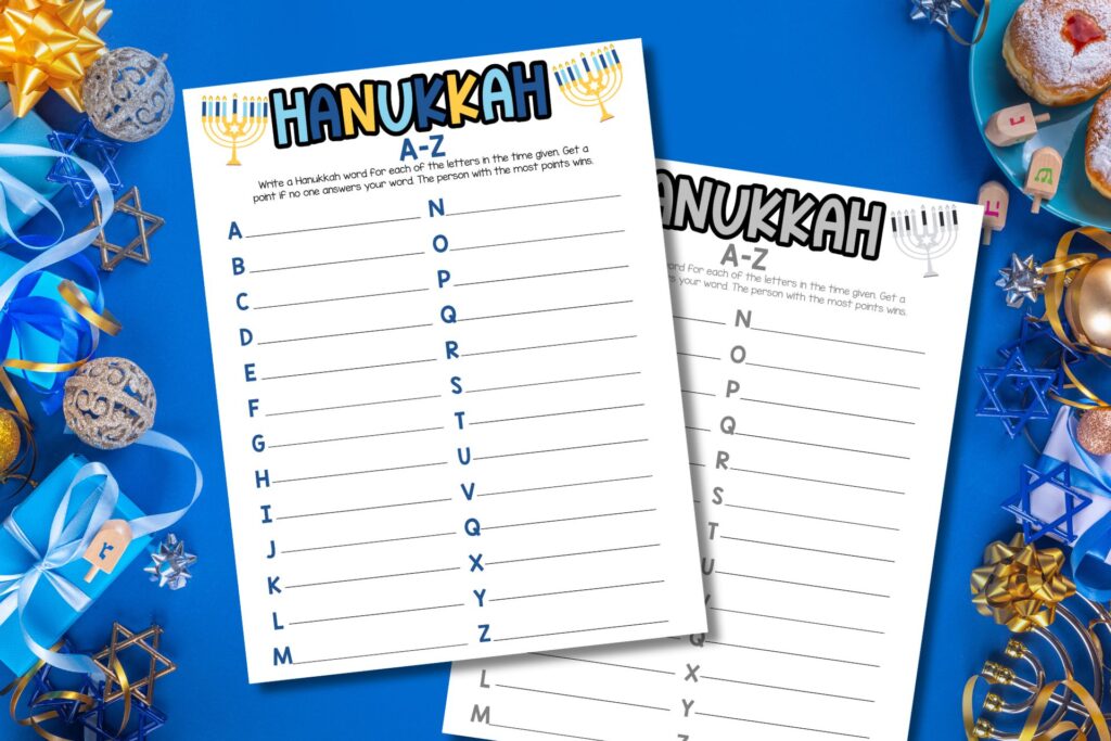 Hanukkah A-Z printable game sheet on a festive blue background with dreidels, gifts, menorah stars, and holiday treats.