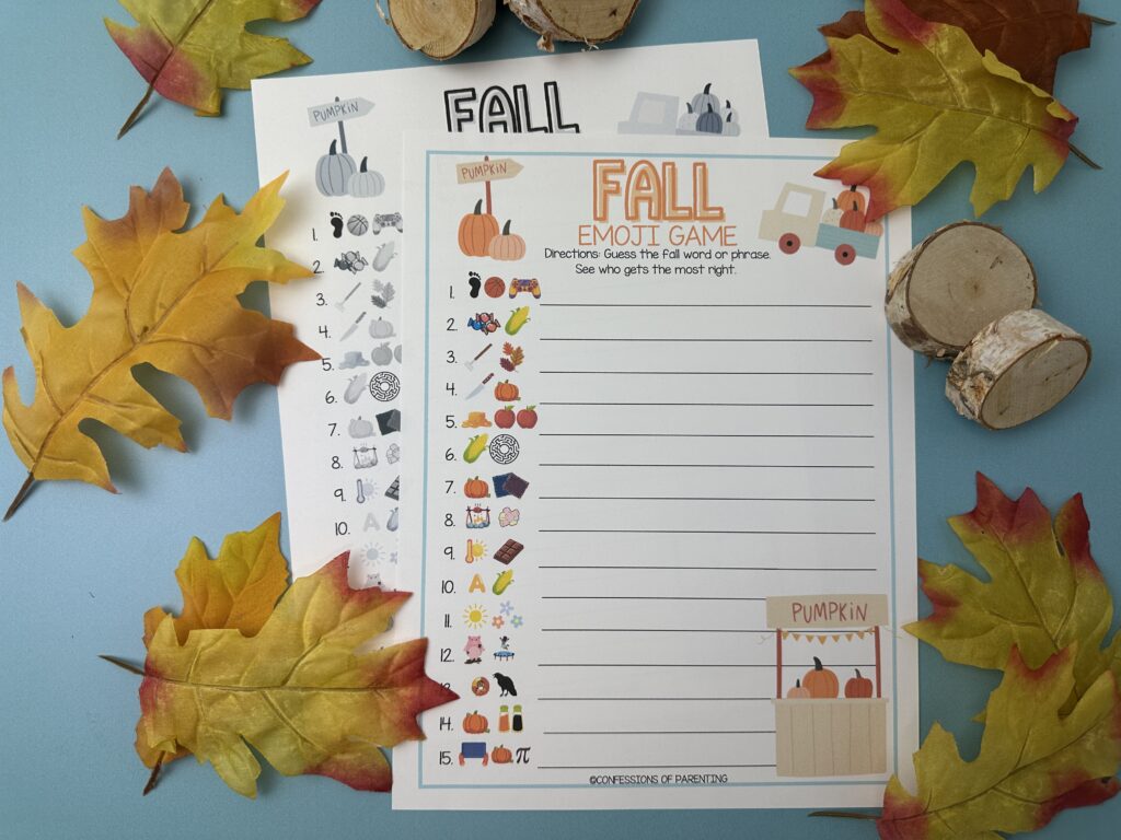 Printable Fall Emoji Game sheet on a blue background with colorful emoji clues and answer spaces, surrounded by fall leaves and wood slices.