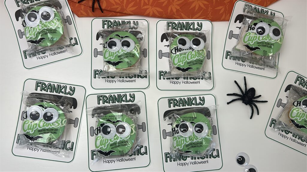 Multiple “Frankly You’re Fang-tastic” treats with googly eyes and black spiders for Halloween gifting.