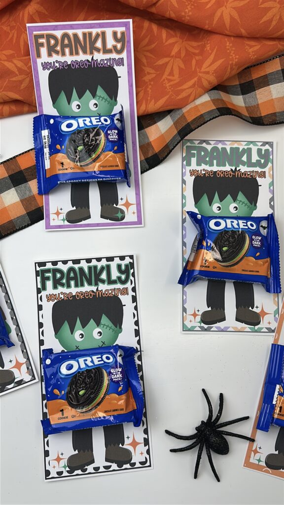 Three Frankenstein Oreo treat printables in green, black, and purple borders laid out with orange fabric and plaid ribbon.