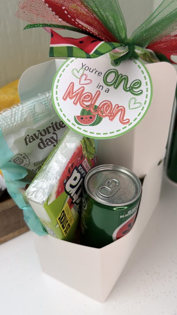 youre one in a melon gift tag attached to drink carrier filled with watermelon treats